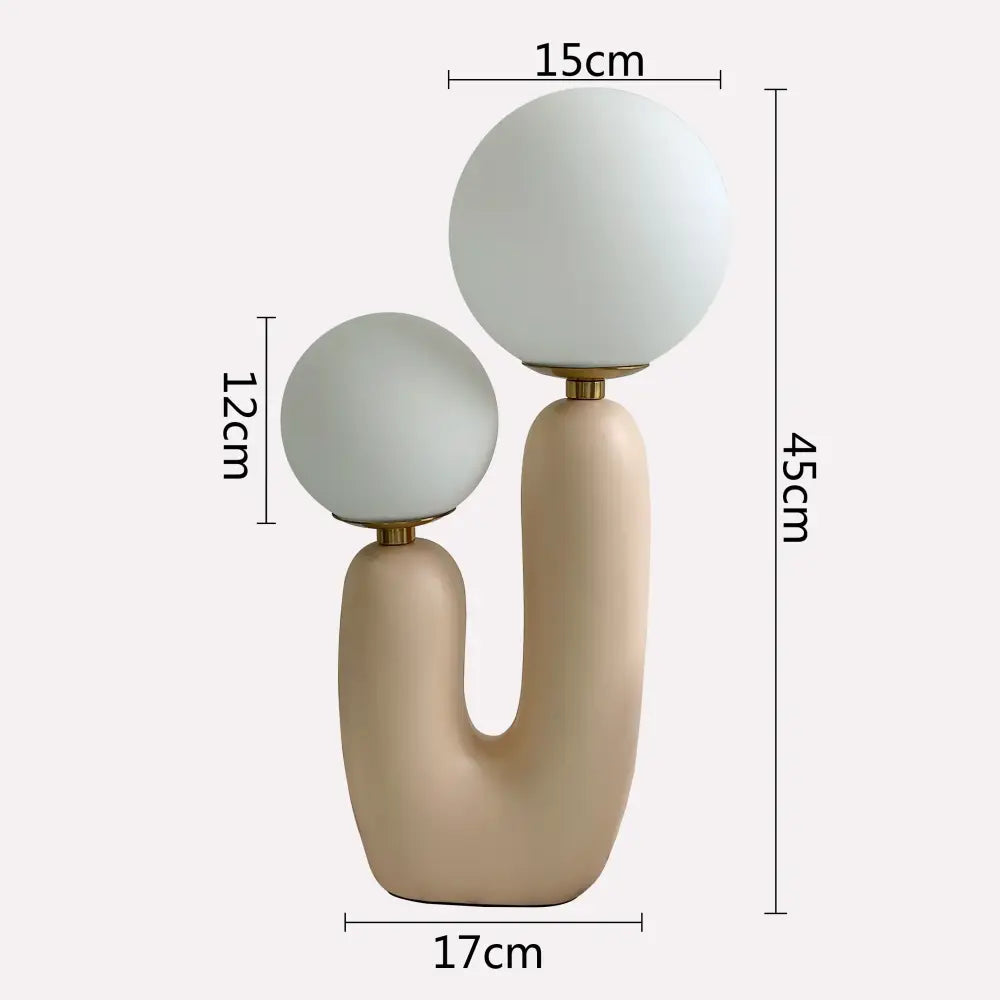 Cream-colored ceramic ball table lamp with two frosted glass globe shades and gold-toned metal accents for bedroom decor