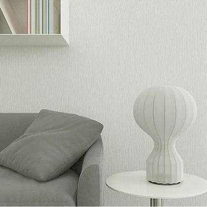 White ribbed ceramic table lamp with sleek modern design featuring silk shade for bedroom decor and gatto silk table use