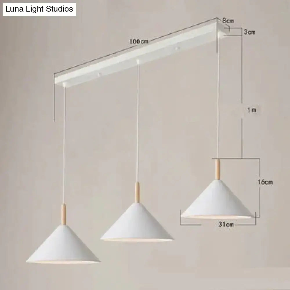 Minimalist nordic simple kitchen pendant light with white conical shades and wooden accents on a matte black ceiling bar