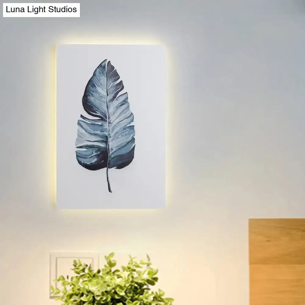 A nordic style 24 inch fixture banana leaf led wall art with blue and gray illumination for living room decor