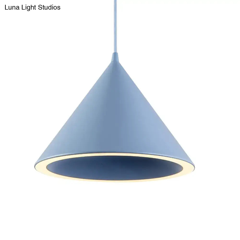 A nordic stylish blue and black metal pendant light with a matte finish and warm led glow hanging lamp for table use