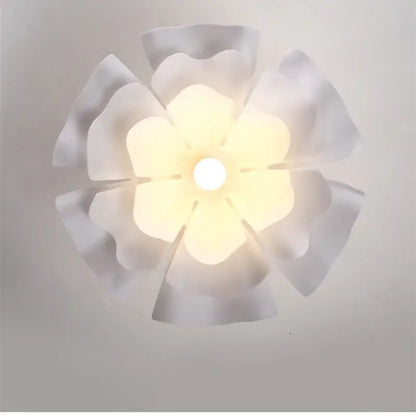 Nordic white acrylic flower pendant chandelier with a soft glowing petal-shaped ceiling light fixture for bedroom decor