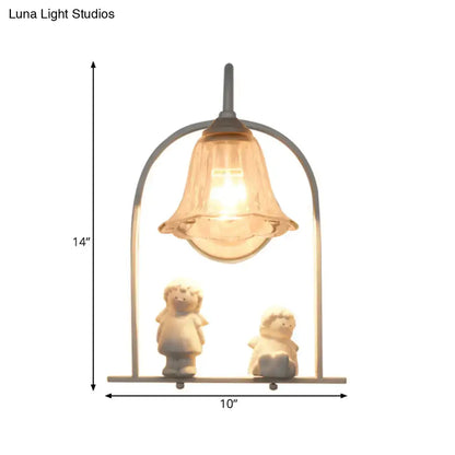 Nordic white arched frame flower glass pendant light with a delicate bell-shaped lamp and two white figurines inside