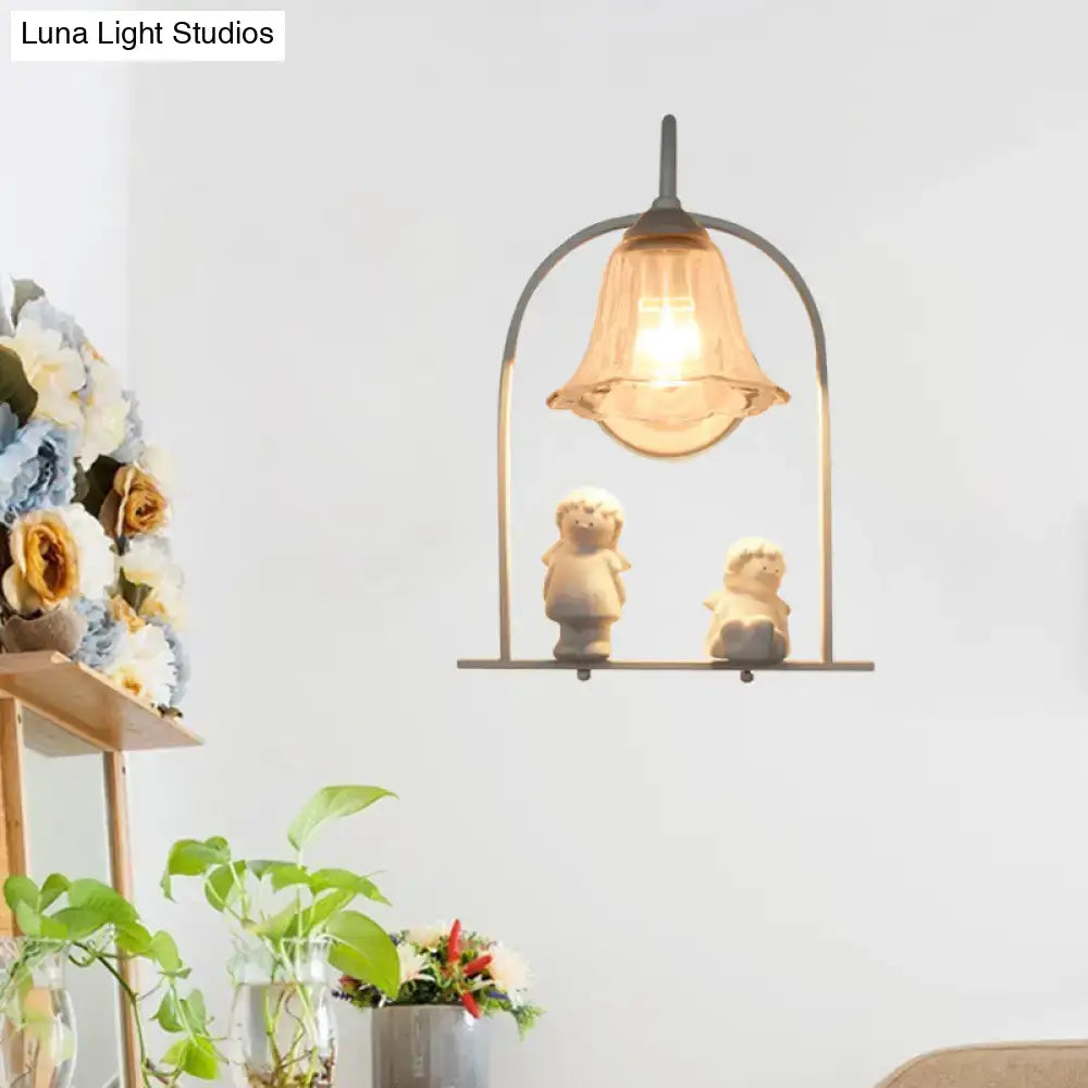 Nordic white arched frame flower glass pendant light with warm-toned bell-shaped glass and stone figurines shelf