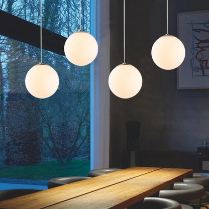Nordic White Glass Globe Pendant Light With Iron Finish - Decorbites