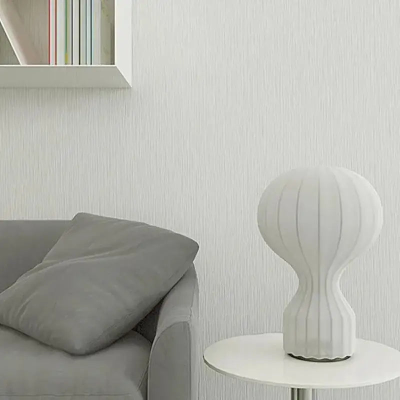 Nordic white ribbed ceramic table lamp with sleek modern design ideal for bedroom decorbites gatto silk lighting