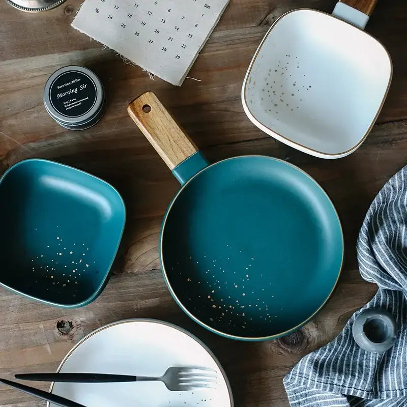Teal ceramic frying pan with wood handle and gold speckles from decorbites ceramic wood handle collection