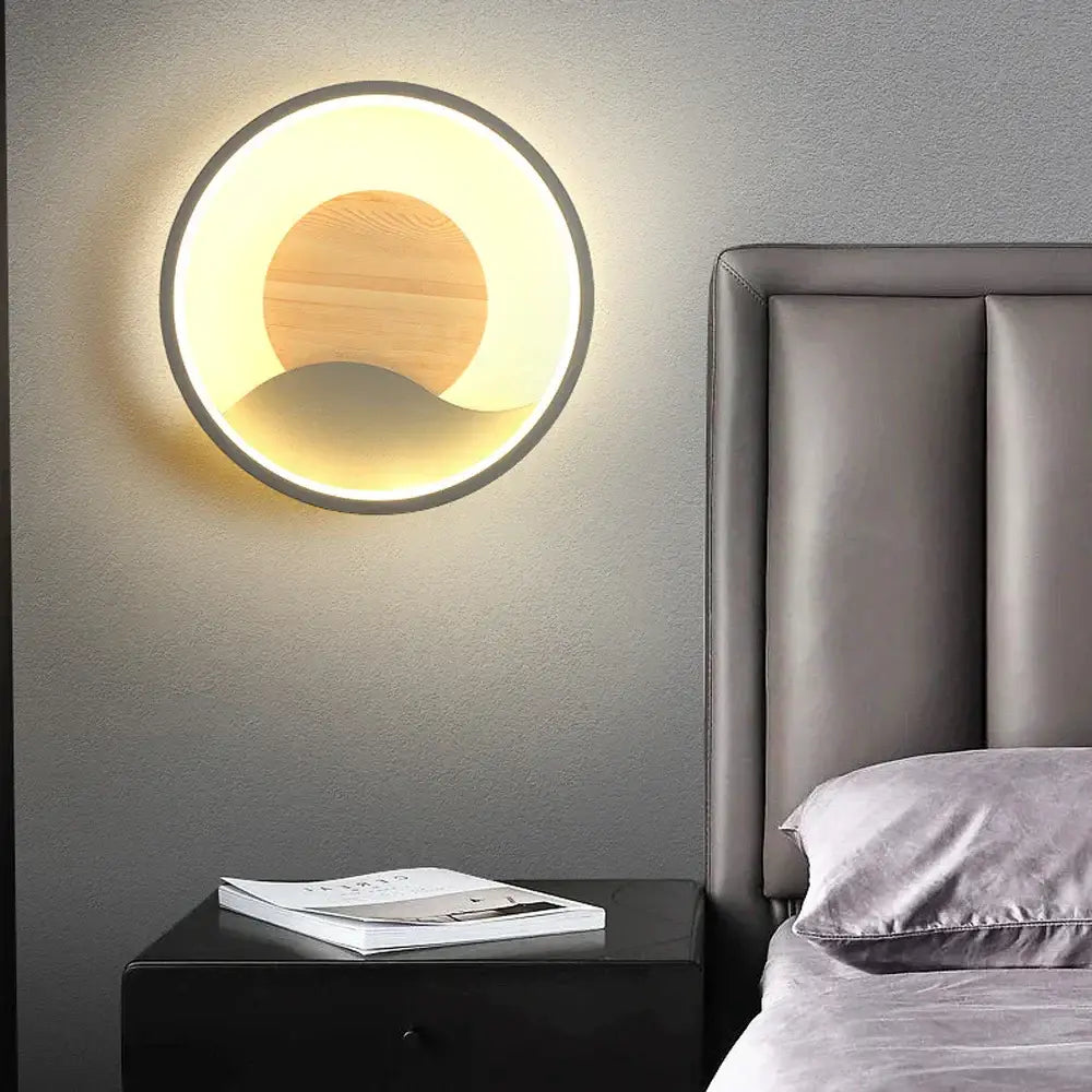 Nordic wood and led wall light with warm glow, wooden disc, and black frame as modern bedroom decorbites led wall light