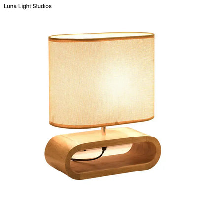 Nordic wood bedside table light with warm-toned oval shade and curved wooden base 12 inch fixture for bedroom