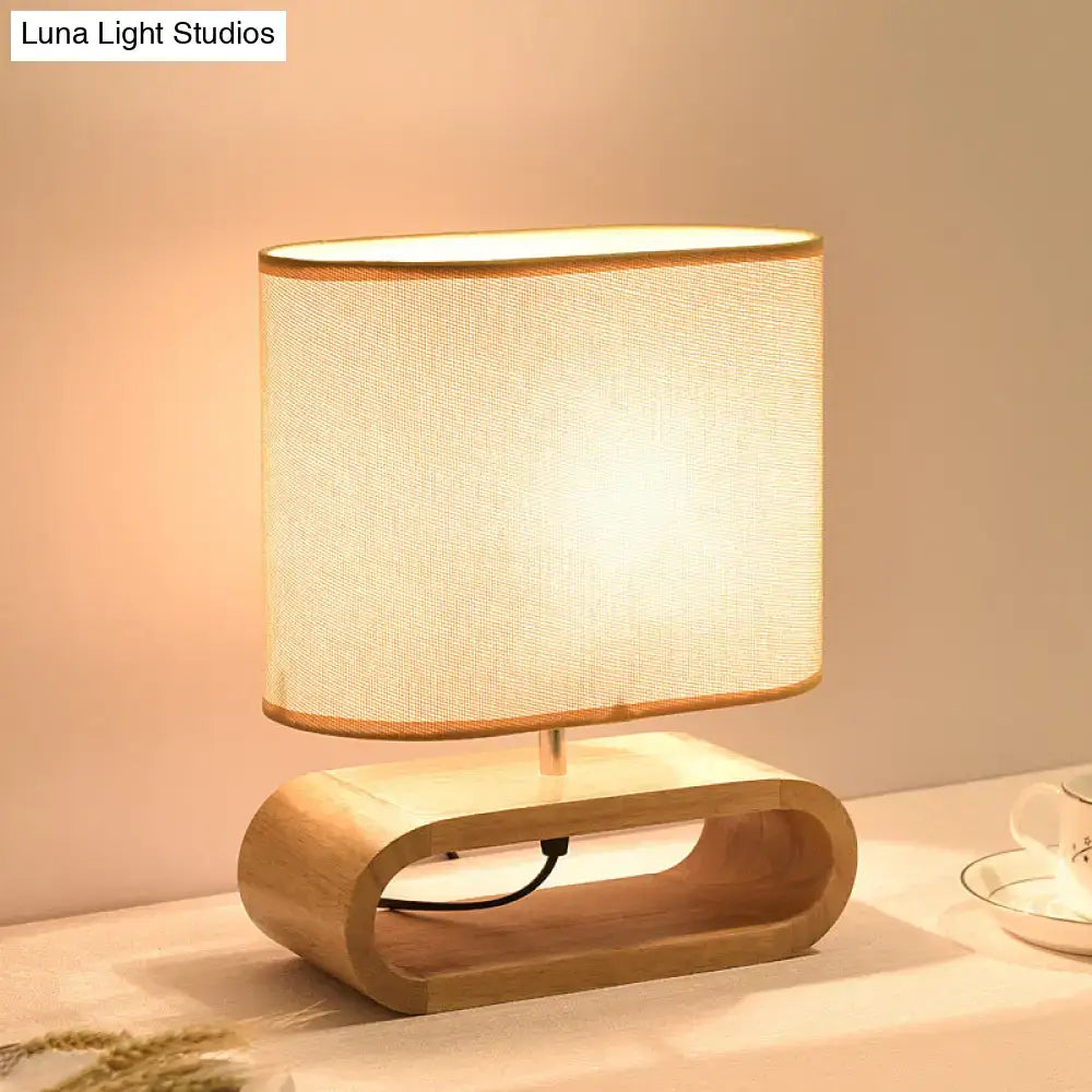 Nordic wood bedside table light with a warm-toned beige fabric shade and light wood base 12 inch fixture