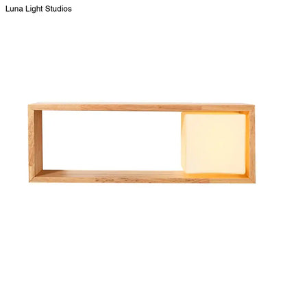 Minimalist nordic wood wall lamp with wooden shelf featuring warm glowing embedded square light bulb base fixture