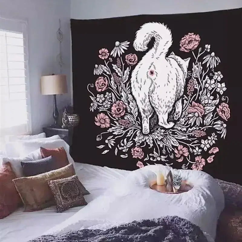 Black tapestry wall art featuring a white illustrated cat surrounded by pink and white floral designs for cat coven decor