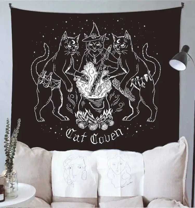 Black cat coven tapestry featuring white line-art of three cats around a cauldron for mysterious bedroom wall art
