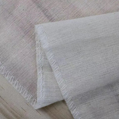 Off-white cotton tofu maker cloth with subtle weave and frayed edges for kitchen homemade cheese decorbites cotton tofu