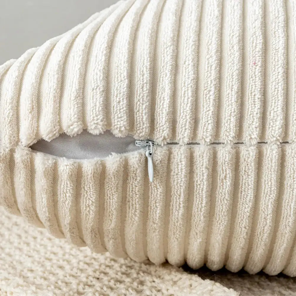 Cream-colored off white ribbed corduroy striped throw pillow cover with visible zipper pull decorbites corduroy striped pillow covers
