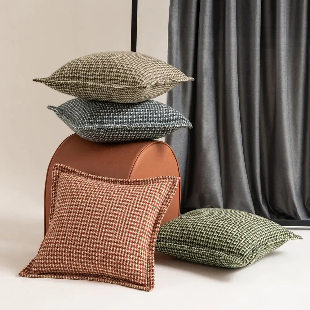 Stacked olive and cream houndstooth jacquard pillow covers in earthy tones with textured woven fabric for living room decorbites cushion covers