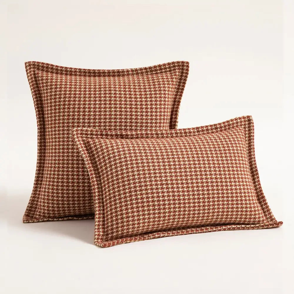 Two rectangular terracotta and cream olive and cream houndstooth jacquard pillow covers from decorbites cushion covers