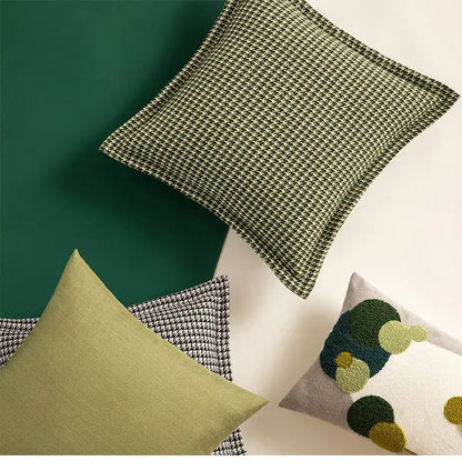 Olive green houndstooth textured throw pillow made of jacquard fabric offering stylish pillow covers and cushion covers by decorbites