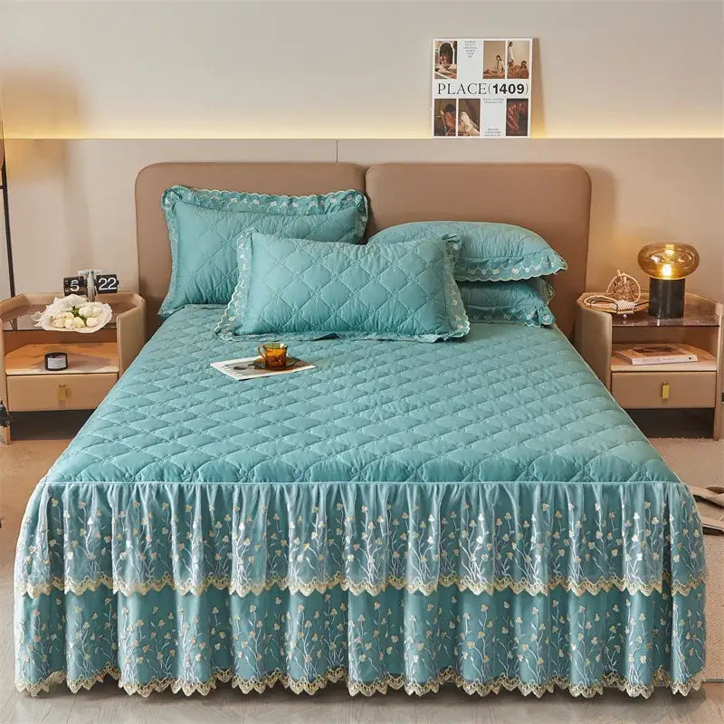 Teal quilted bed skirt set with floral embroidery and lace trim complementing olive green and white bedroom decor