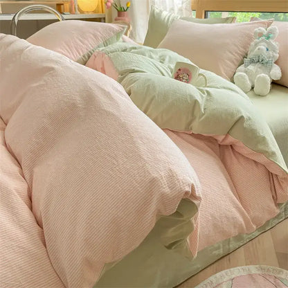 Pastel pink and mint green textured cotton duvet set with subtle ribbed pattern in decorbites cozy striped cotton bedding set