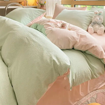 Pastel green and pink striped duvet set with soft textured fabric in decorbites cozy striped cotton bedding set