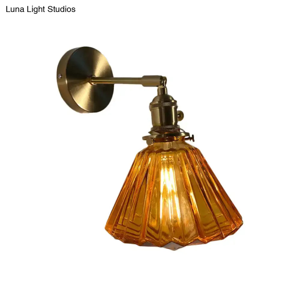 Vintage-style bedroom wall lamp with brass finish and amber fluted glass shade for elegant bedroom wall lighting