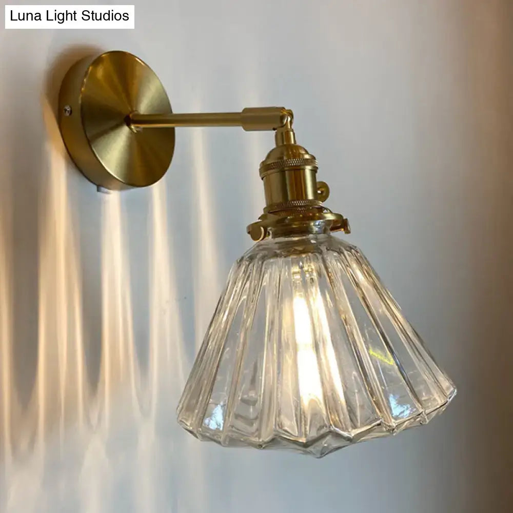 Vintage-style brass bedroom wall lamp with clear fluted orange and gold glass shade for bedroom wall lighting