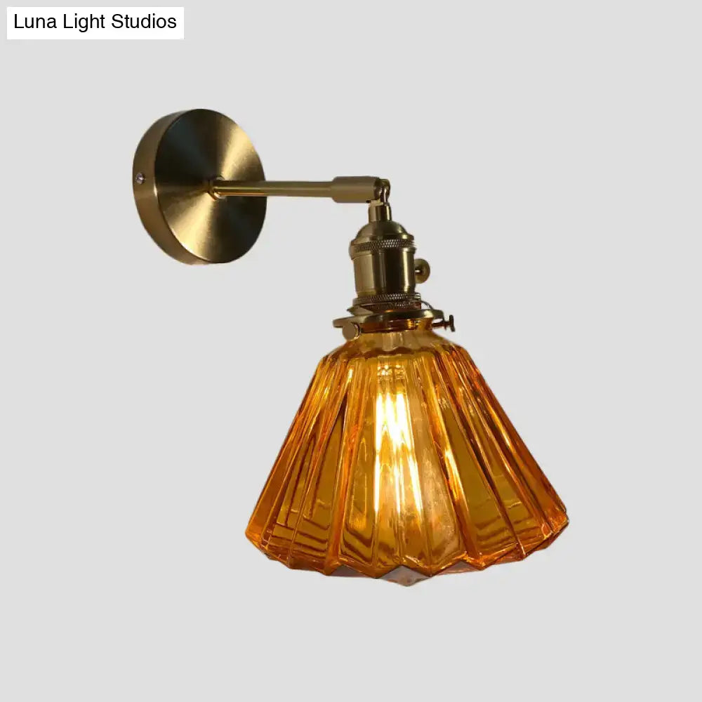 Vintage-style bedroom wall lamp with warm amber fluted glass shade and brass-finished metal for bedroom wall use