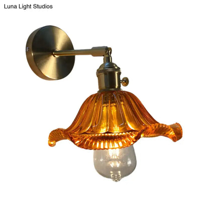Orange and gold fluted glass wall lamp with warm amber petal-like glass and brass hardware for bedroom wall lamp use