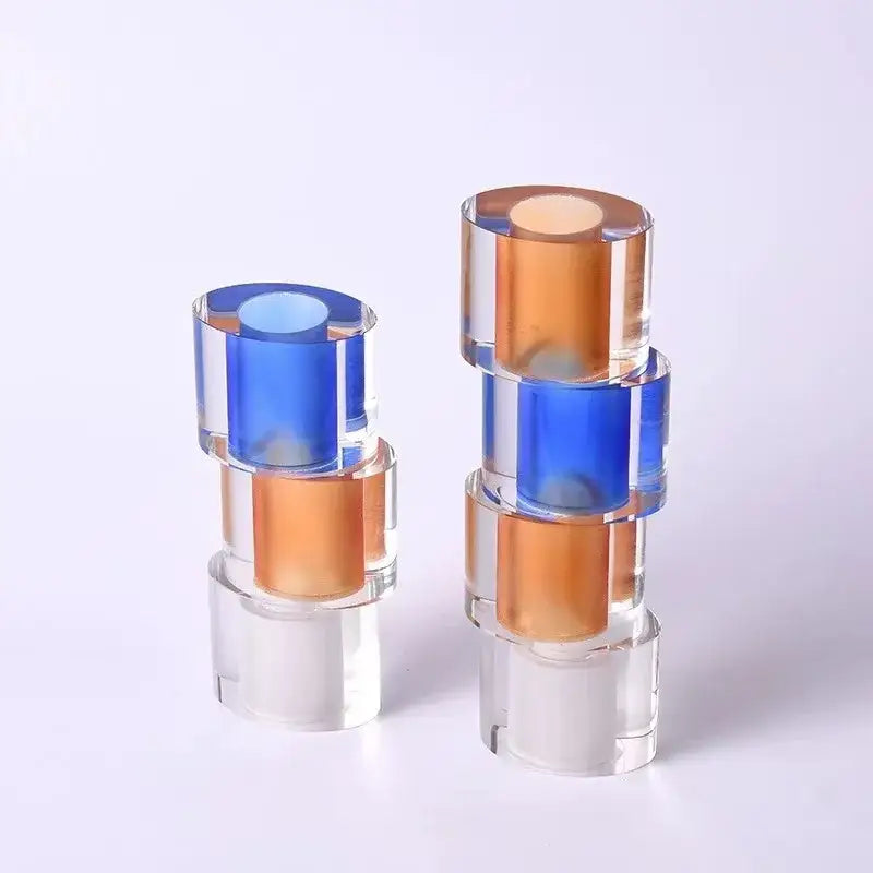 Stacked translucent blue and amber acrylic cylinders in a clear crystal mosaic vase for living room decorbites candle holder