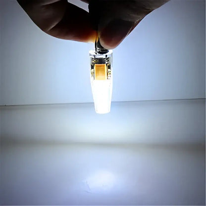 A sleek transparent led bulb clip with a metallic base and orange internal component decorbites g4 led 220v cob light