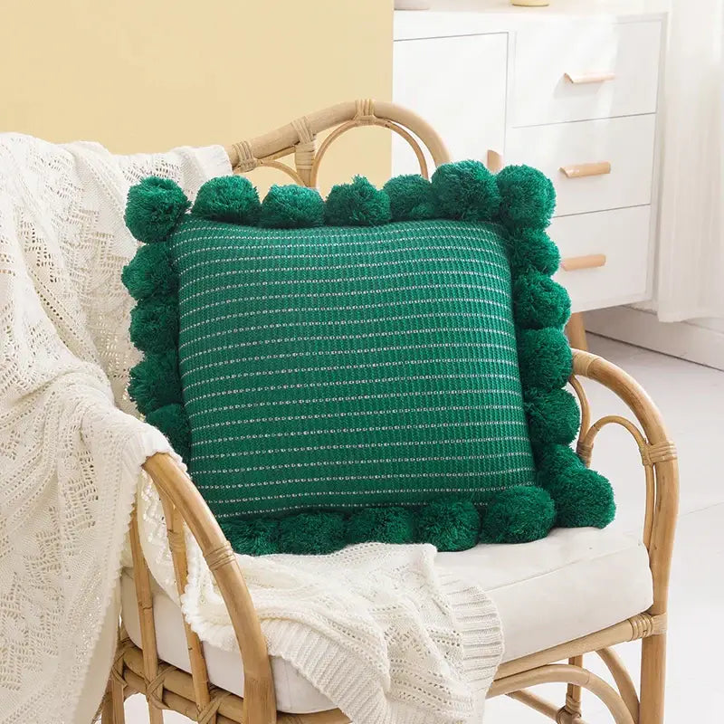 Emerald green woven ball cushion cover with fluffy pom-pom border for living room decor and comfort