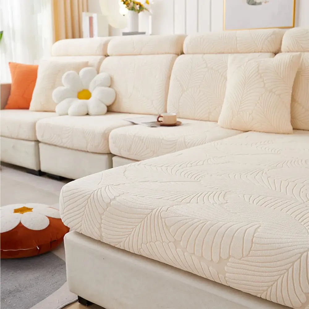 Cream-colored orange and white leaf jacquard stretch sofa cover with soft textured fabric for living room protection