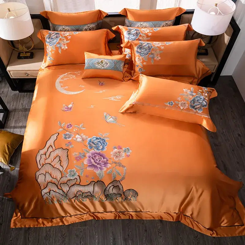 Orchid and blue floral embroidered satin bedding set in vibrant orange made from 200s embroidery Egyptian cotton
