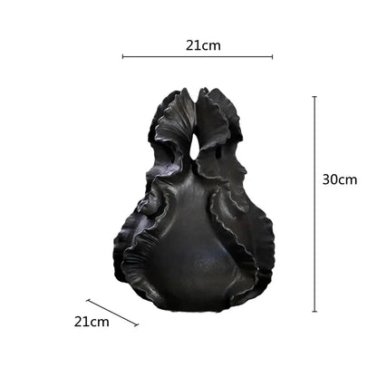 A sleek matte black ceramic wavy flower vase with organic ridges for living room decorbites ceramic wavy storage