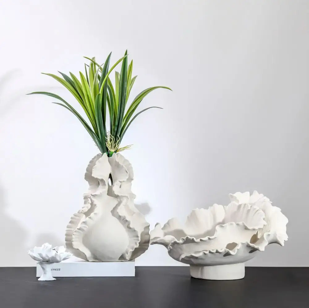 White ceramic wavy flower vase with ruffled leaf texture and green plant for decorbites ceramic wavy living room decor
