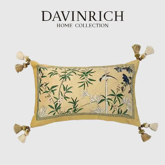 A rectangular beige orchid velvet lumbar pillow cover with embroidered green bamboo leaves and blue birds from davinrich home