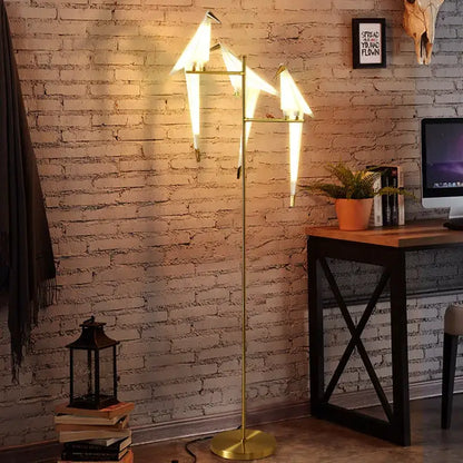 Gold-colored decorbites bird led floor lamp with three illuminated origami bird shades for living room decor