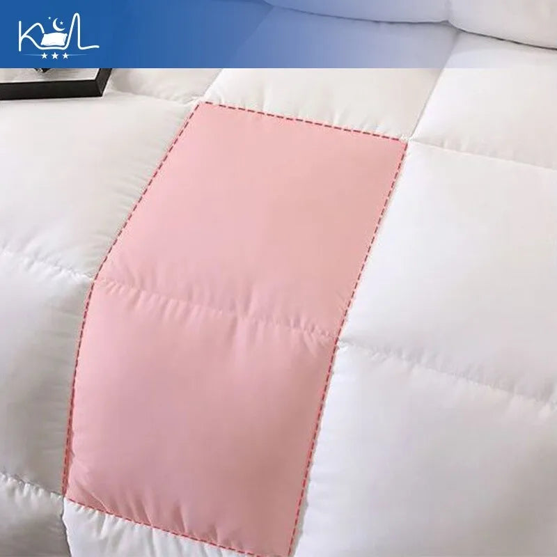 A soft pink stitched patch on white quilted fabric of original Japanese made 95% white goose down quilt comforter
