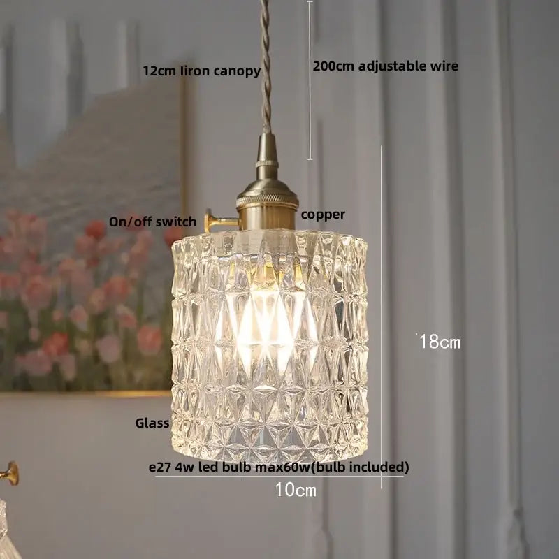 Clear glass pendant light with faceted geometric design and brass-colored copper led hardware for café lighting