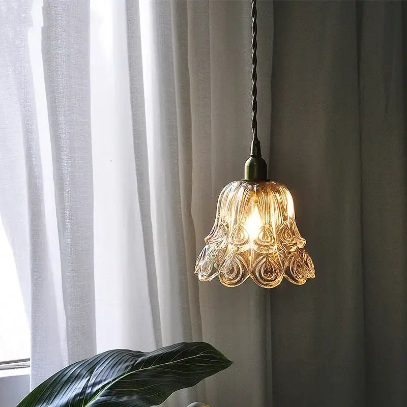 Ornate warm-toned amber copper led pendant light with petal design and antique brass finish for café and dining room