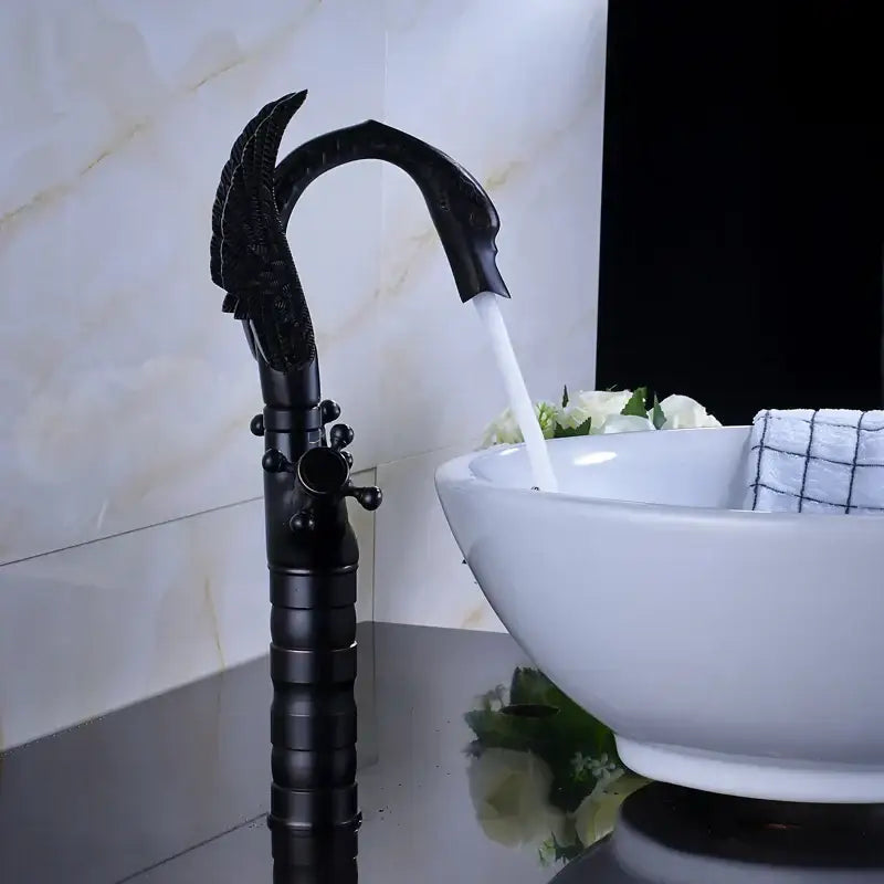 Ornate black bronze swan basin faucet with sculpted bird head and textured cylindrical body by decorbites black bronze