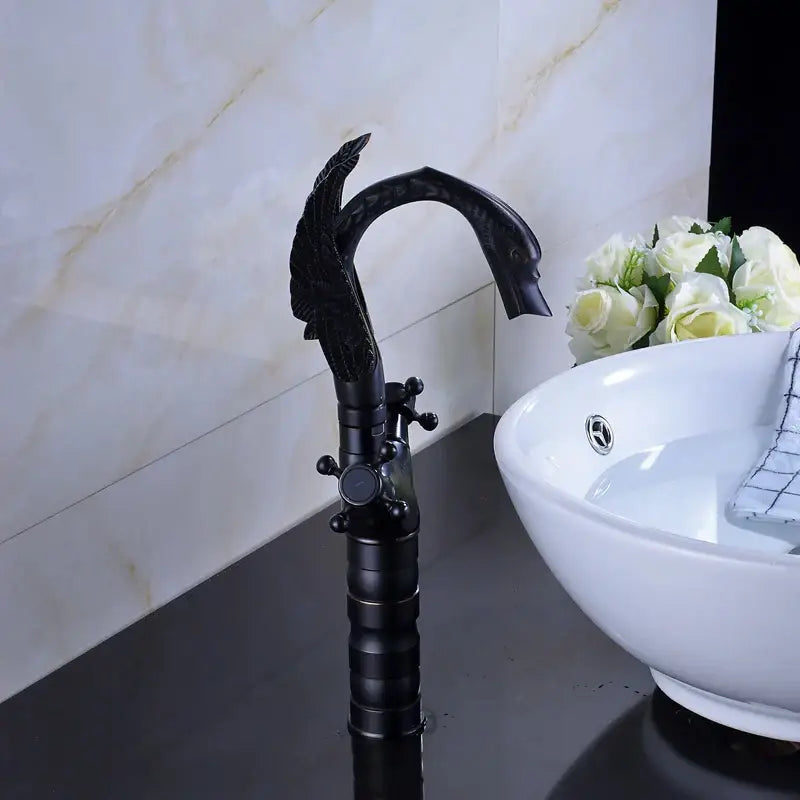 Ornate black bronze swan basin faucet with dual cross handles and matte finish by decorbites for bathroom mixer use
