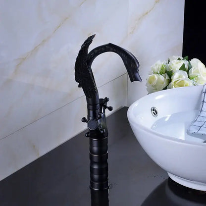 Ornate black bronze swan basin faucet with dual cross handles and matte finish by decorbites for bathroom mixer use