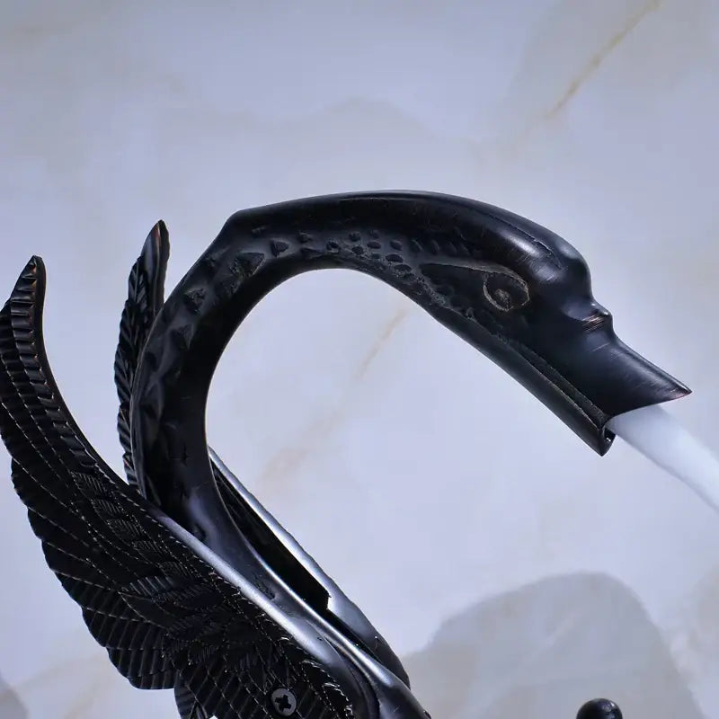 Ornate decorbites black bronze black bronze swan basin faucet with detailed feathered wings and dual cross handles