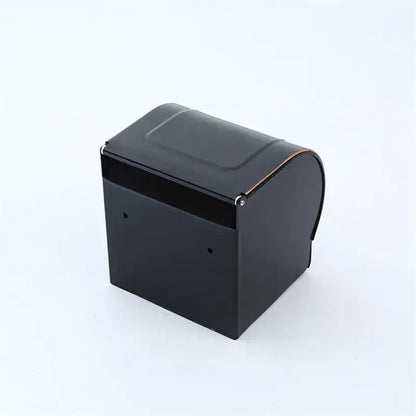 Black rectangular cash register with curved top and metallic hinge shown alongside decorbites black carved aluminum toilet paper holder