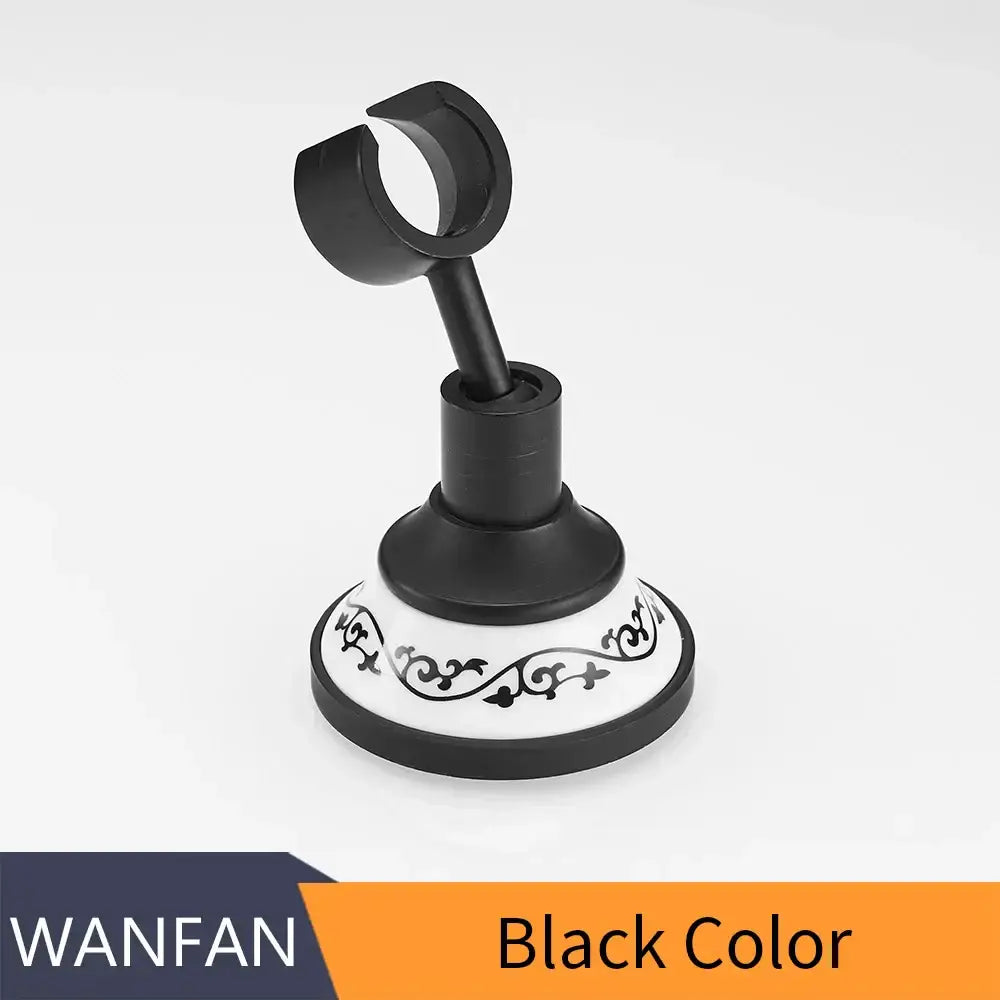 Ornate black and white ceramic handheld shower mount with scrollwork design black plastic shower mount bracket