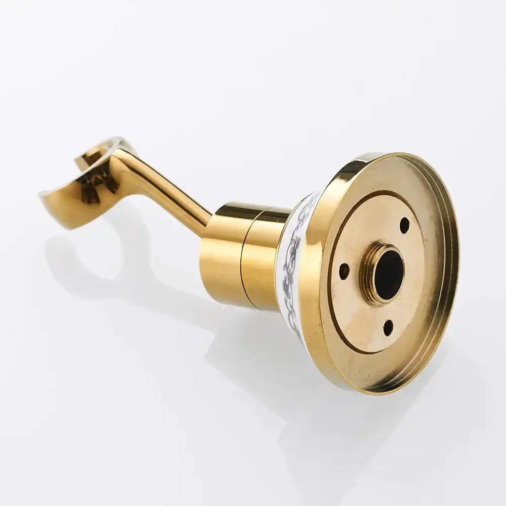 Gold-colored brass shower mount with curved handle and decorative white band for handheld shower bracket use