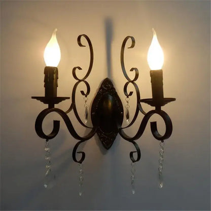 Ornate black wrought iron wall lamp with dark bronze scrollwork and crystal accents for living room decorbites black wrought