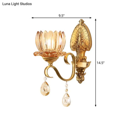 Ornate brass lotus wall sconce with gold-toned finish amber glass shade and crystal pendants for e14 bulb lighting